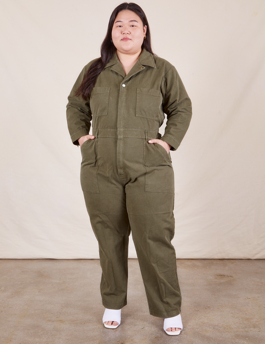 Ashley is 5'7" and wearing 1XL Everyday Jumpsuit in Surplus Green