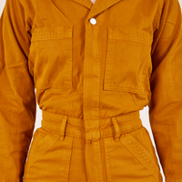 Front close up of Everyday Jumpsuit in Spicy Mustard worn by Alex