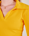 Front close up of Long Sleeve Fisherman Polo in Sunshine Yellow worn by Alex
