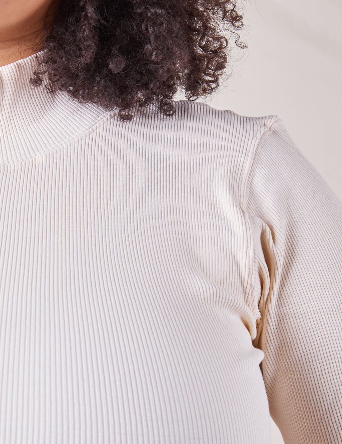 Front shoulder close up of 1/2 Sleeve Essential Turtleneck in Vintage Off-White on Lana