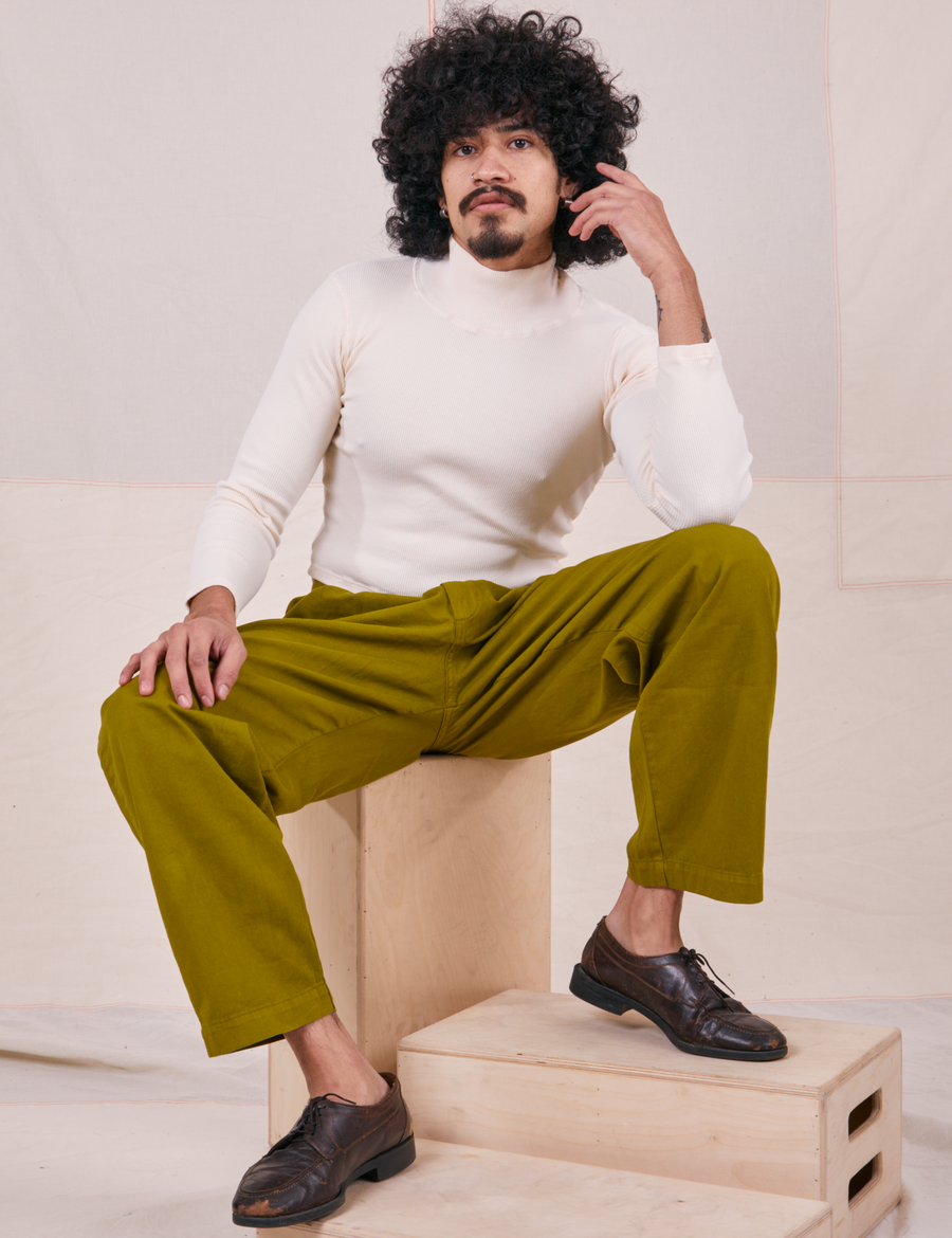 Jesse is wearing Essential Turtleneck in Vintage Off-White