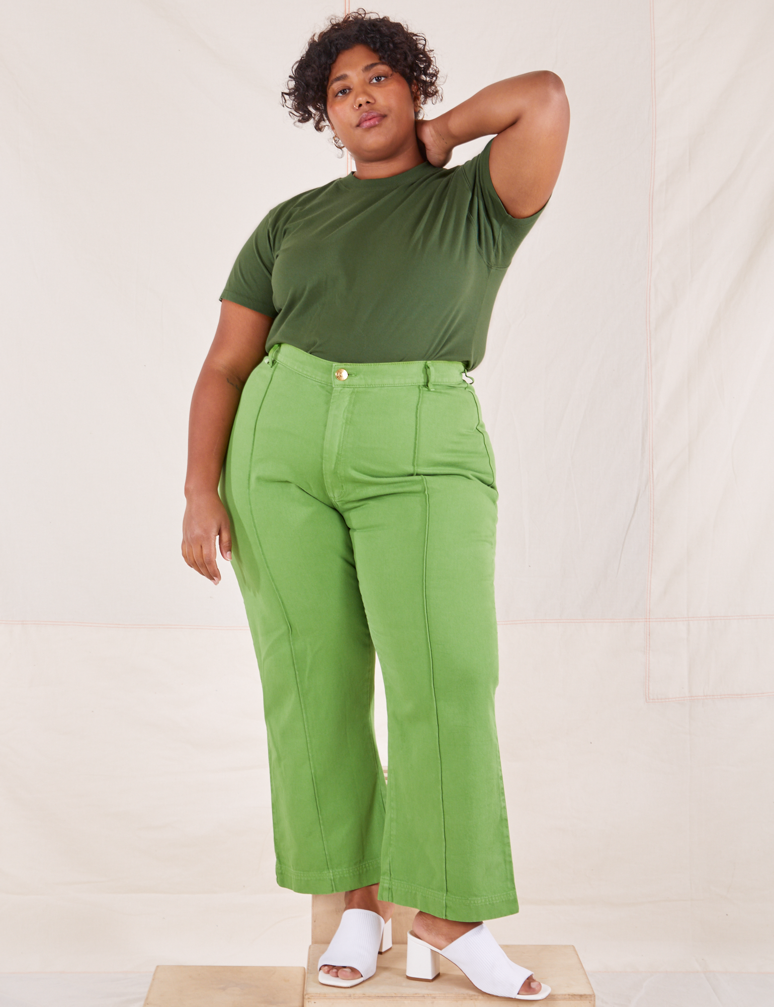 Morgan is wearing L Organic Vintage Tee in Dark Emerald Green paired with gross green Western Pants