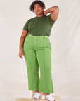 Morgan is wearing L Organic Vintage Tee in Dark Emerald Green paired with gross green Western Pants