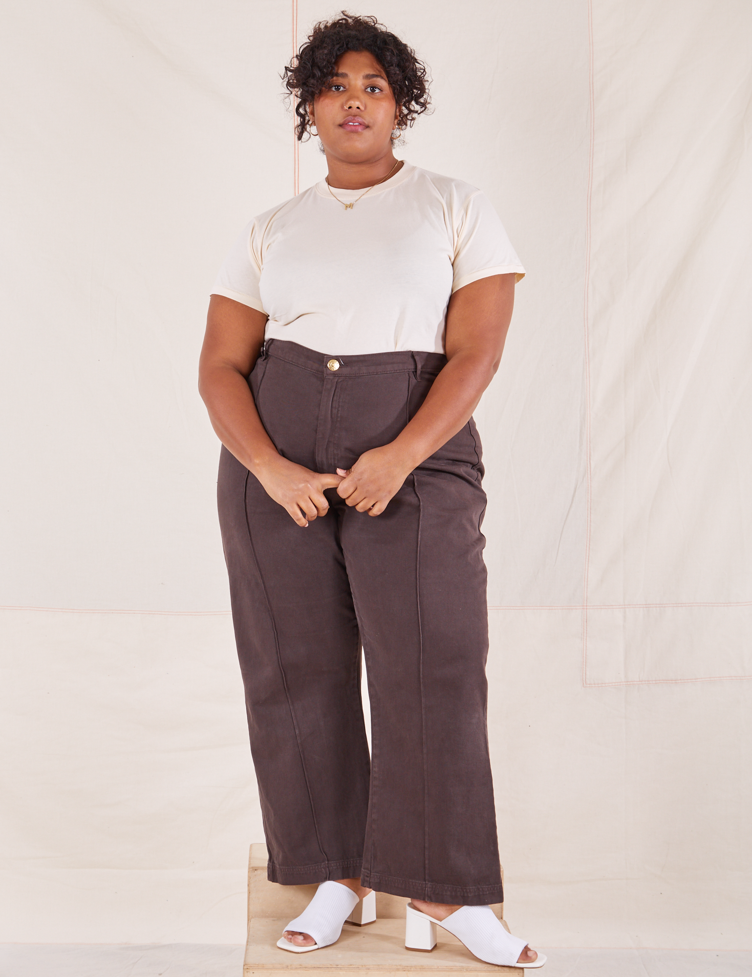 Morgan is wearing L Organic Vintage Tee in Vintage Off-White paired with espresso brown Western Pants