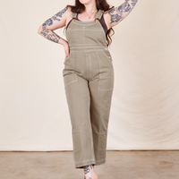 Sydney is 5'9" and wearing M Original Overalls in Khaki Grey