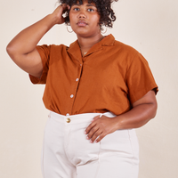 Morgan is wearing Pantry Button-Up in Burnt Terracotta tucked into vintage off-white Western Pants
