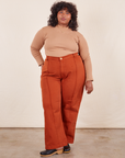 Morgan is 5'5" and wearing 1XL Western Pants in Burnt Terracotta and tan Essential Turtleneck