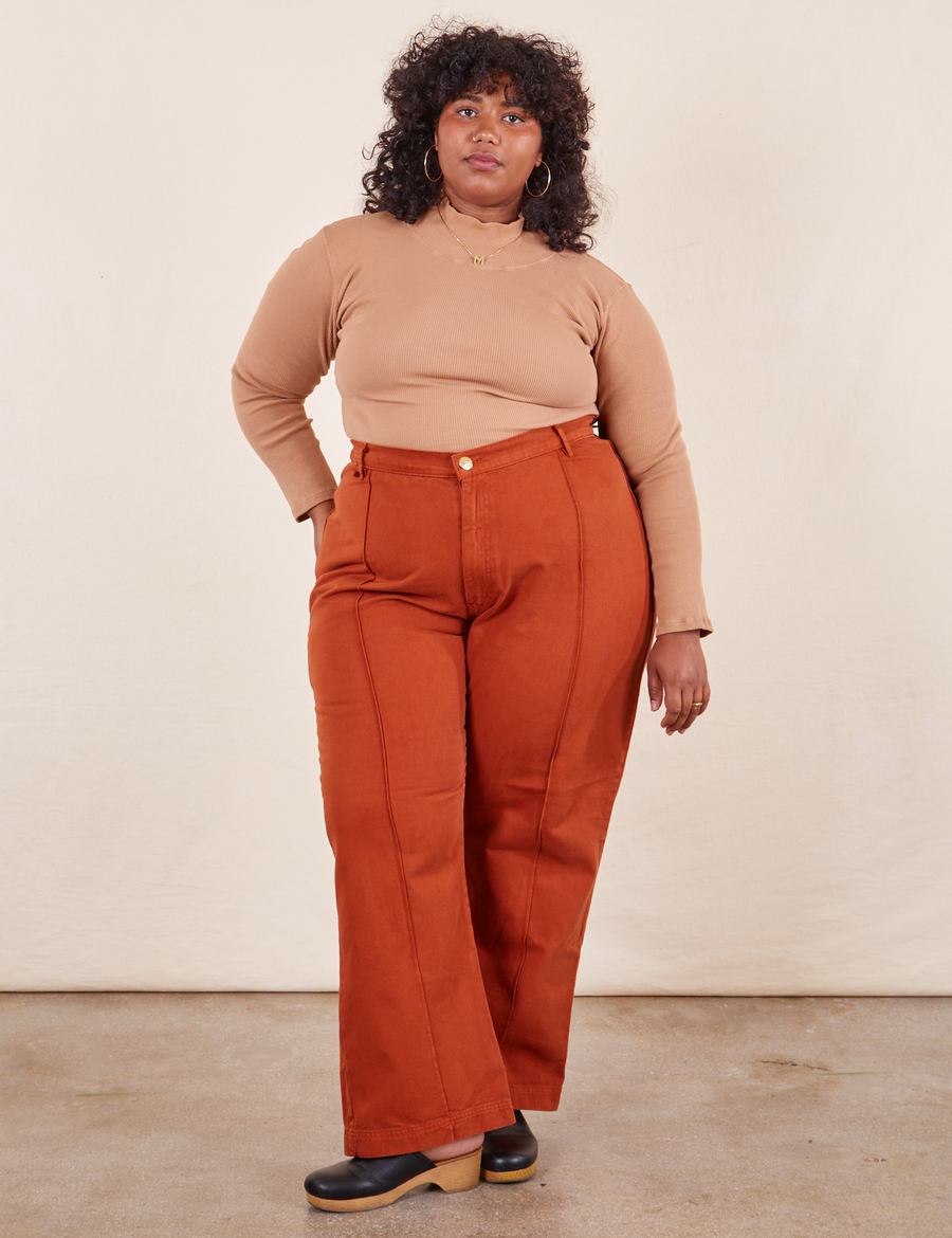 Western Pants in Burnt Terracotta on Morgan wearing tan Essential Turtleneck