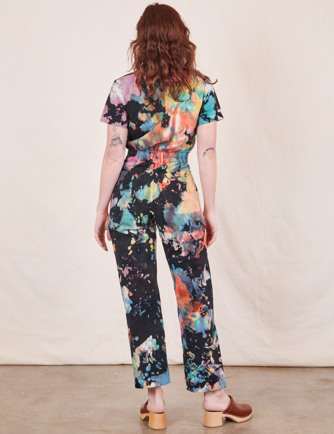 Short Sleeve Jumpsuit in Rainbow Magic Waters back view on Alex
