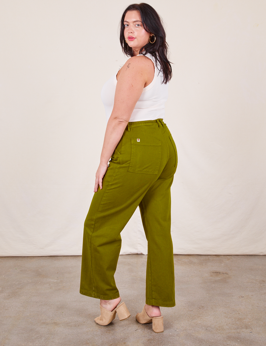 Work Pants in Olive Green side view on Faye wearing vintage off-white Tank Top
