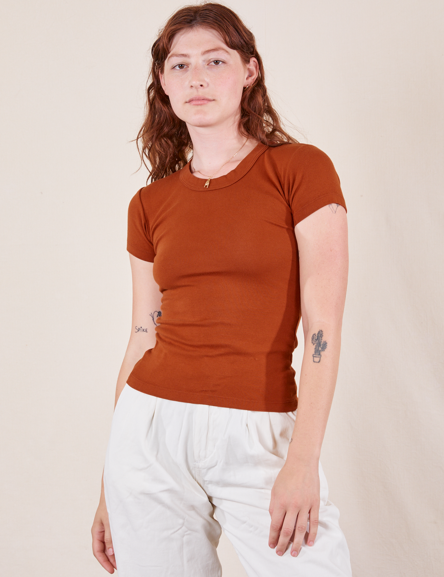 Alex is wearing Baby Tee in Burnt Terracotta