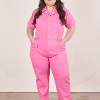 Ashley is 5'7" and wearing size 1XL Short Sleeve Jumpsuit in Bubblegum Pink