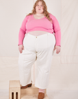 Catie is wearing Long Sleeve V-Neck Tee in Bubblegum Pink and vintage off-white Western Pants