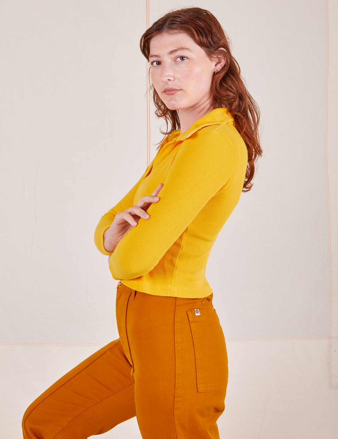 Long Sleeve Fisherman Polo in Sunshine Yellow side view on Alex wearing spicy mustard Western Pants