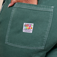 Original Overalls in Dark Emerald Green back pocket close up with Artist TOGS tag
