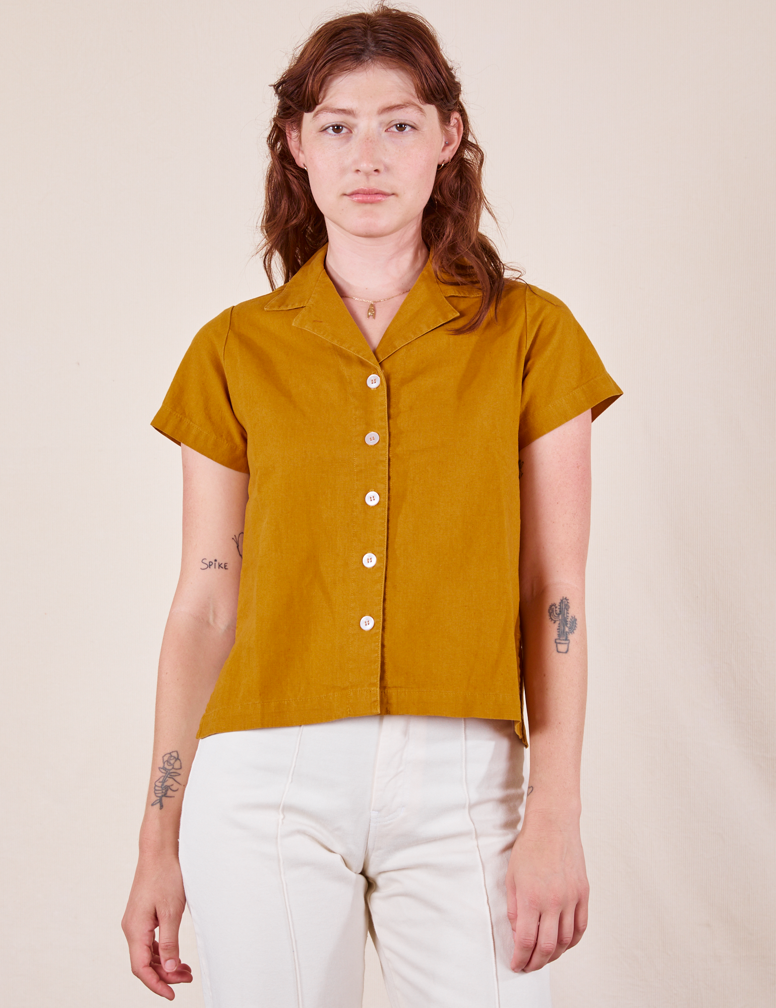 Alex is wearing Pantry Button-Up in Spicy Mustard