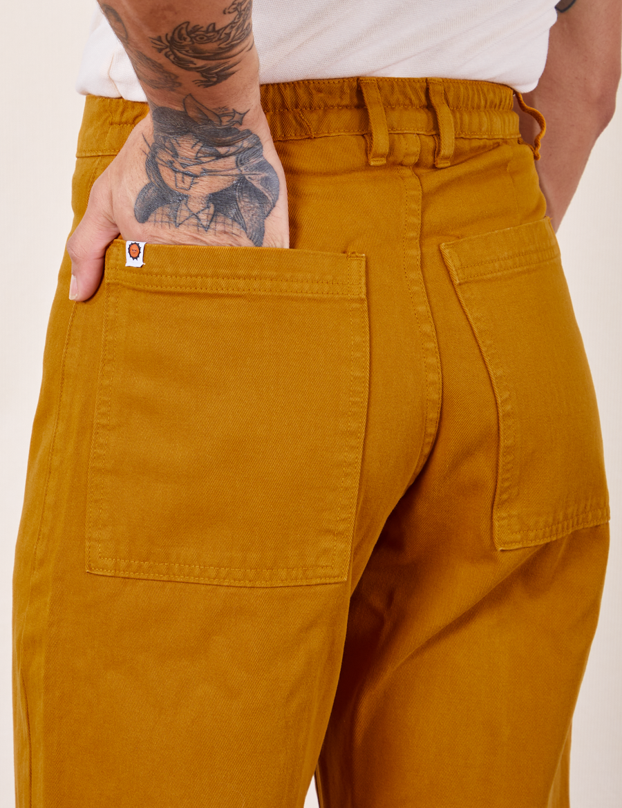 Western Pants in Spicy Mustard hand in back pocket