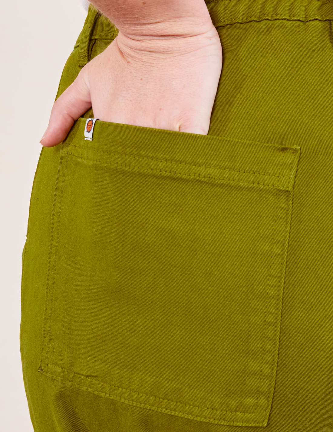 Work Pants in Olive Green back pocket close up