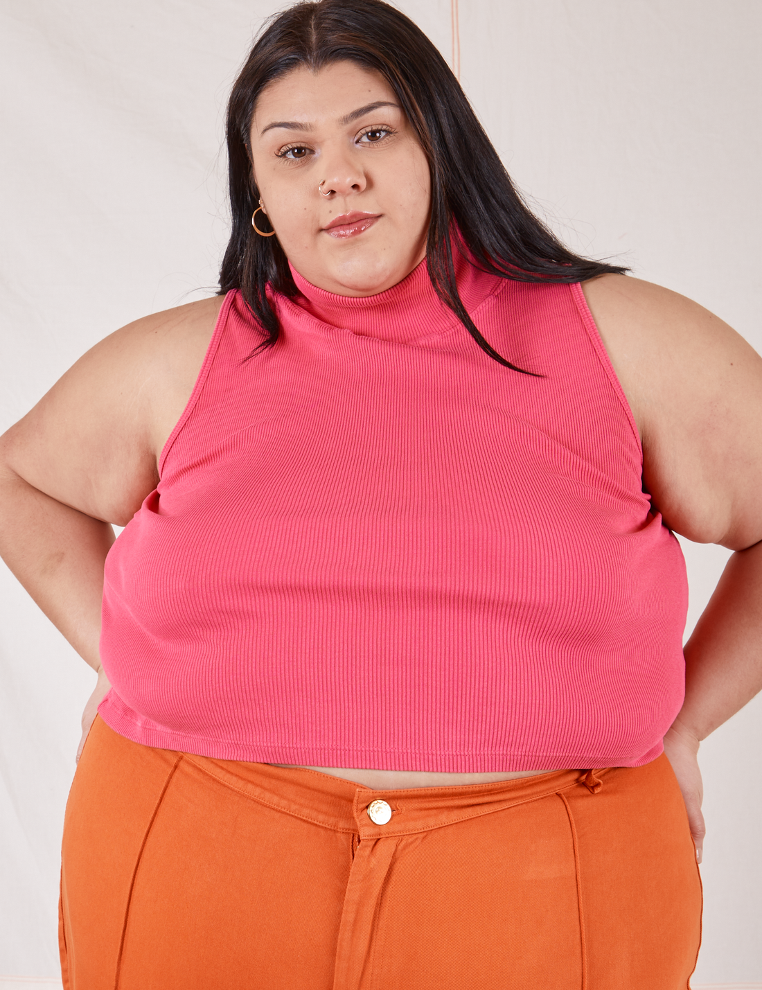 Sarita is wearing 2XL Sleeveless Essential Turtleneck in Hot Pink