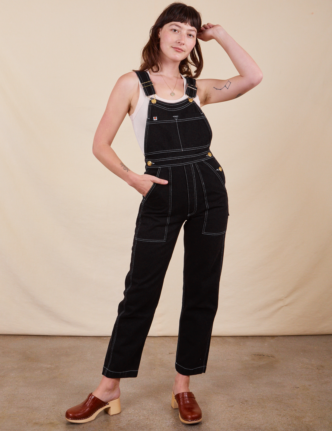 Alex is 5'8"and wearing P Original Overalls in Basic Black