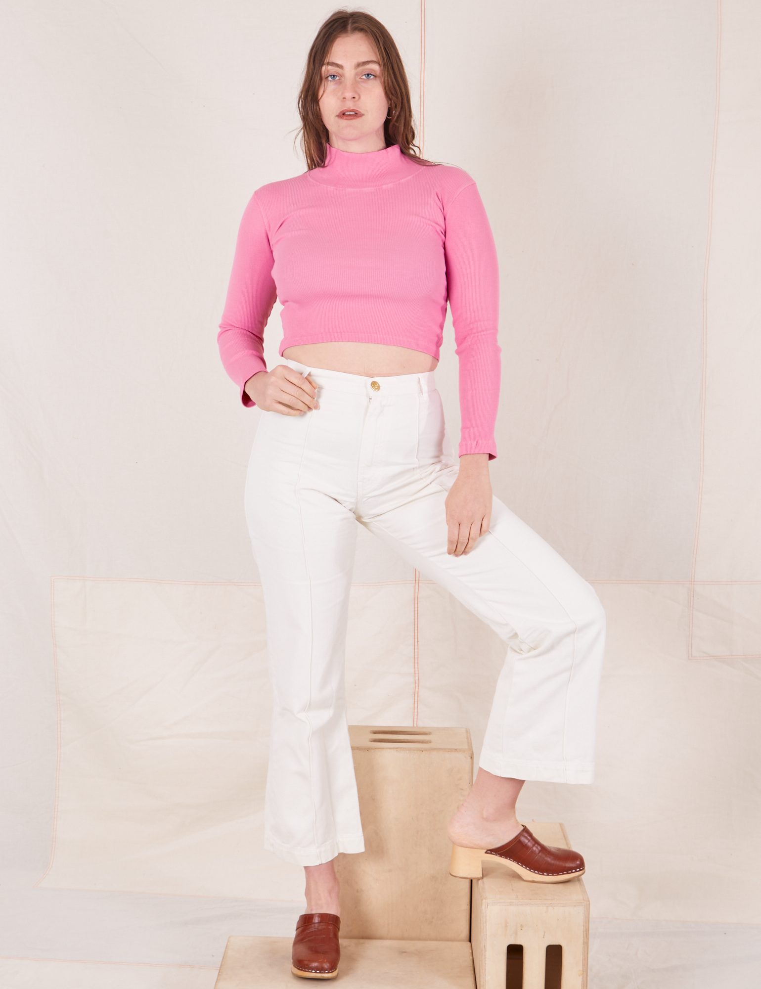 Allison is wearing Essential Turtleneck in Bubblegum Pink and vintage off-white Western Pants