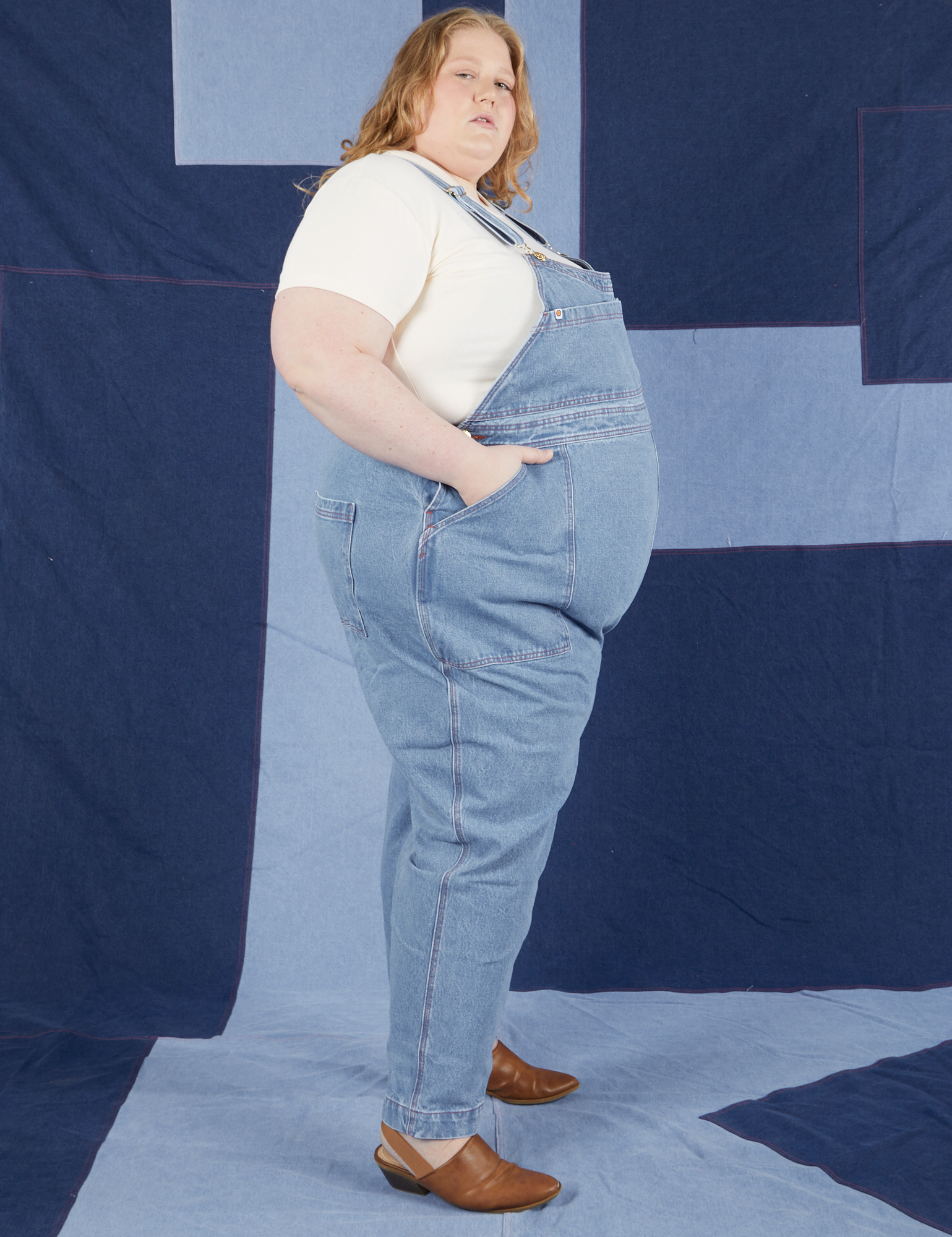 Indigo Denim Original Overalls in Light Wash side view on Catie wearing vintage off-white Baby Tee