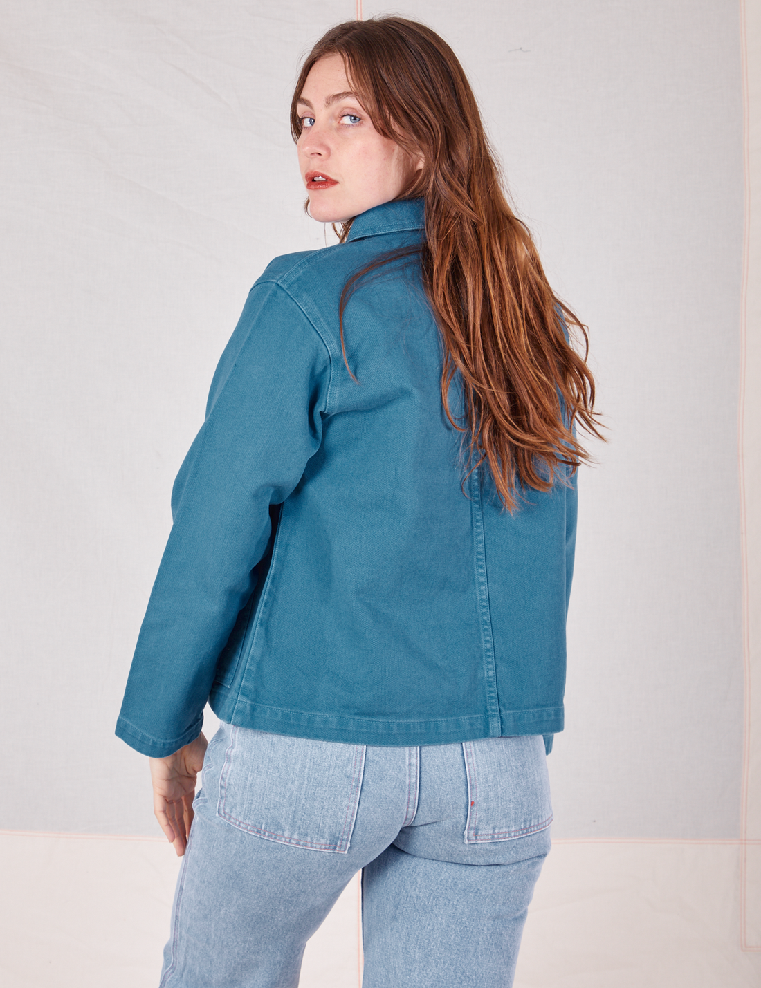 Back view of Denim Work Jacket in Marine Blue worn by Allison