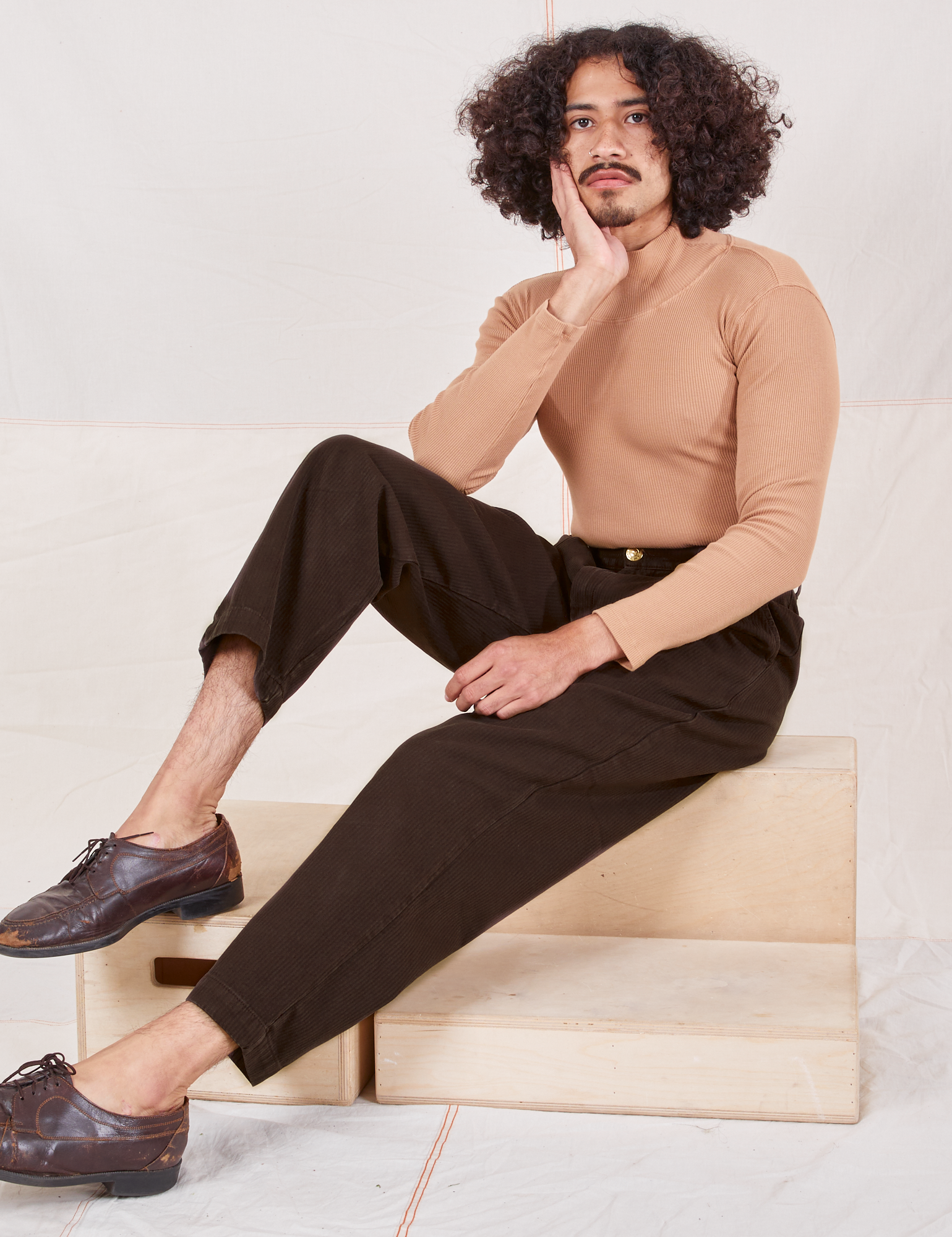 Heritage Trousers in Espresso Brown on Jesse wearing tan Essential Turtleneck