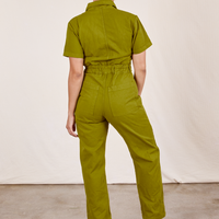 Back view of Short Sleeve Jumpsuit in Olive Green worn by Tiara