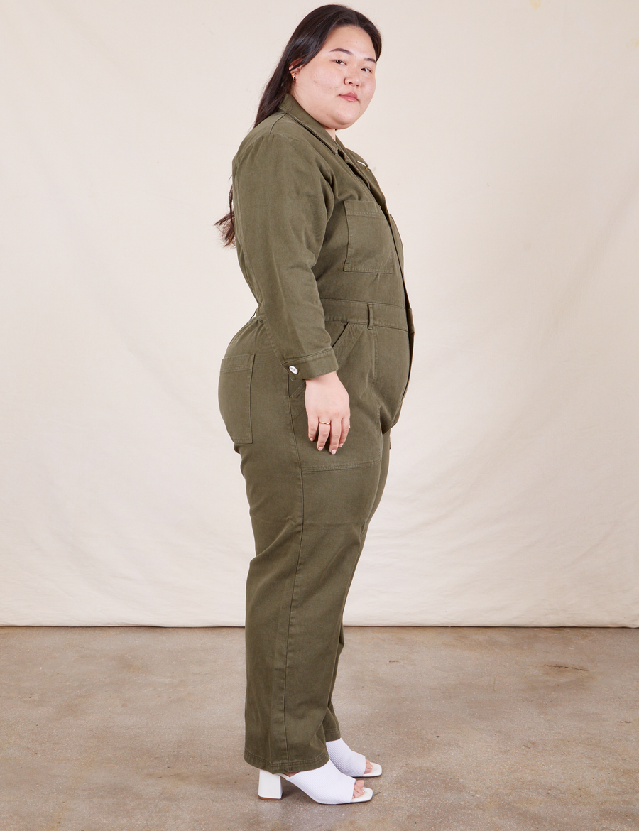 Side view of Everyday Jumpsuit in Surplus Green worn by Ashley