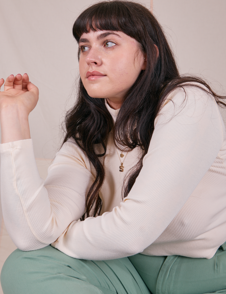Sydney is wearing Essential Turtleneck in Vintage Off-White