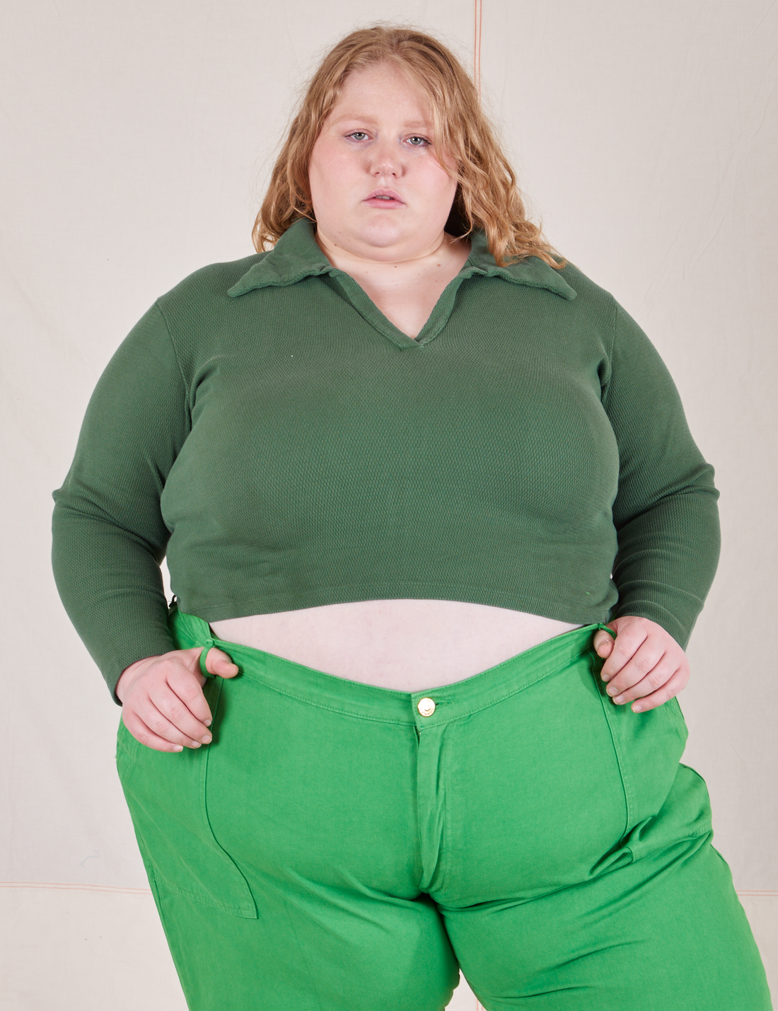 Catie is wearing size 3XL Long Sleeve Fisherman Polo in Dark Emerald Green