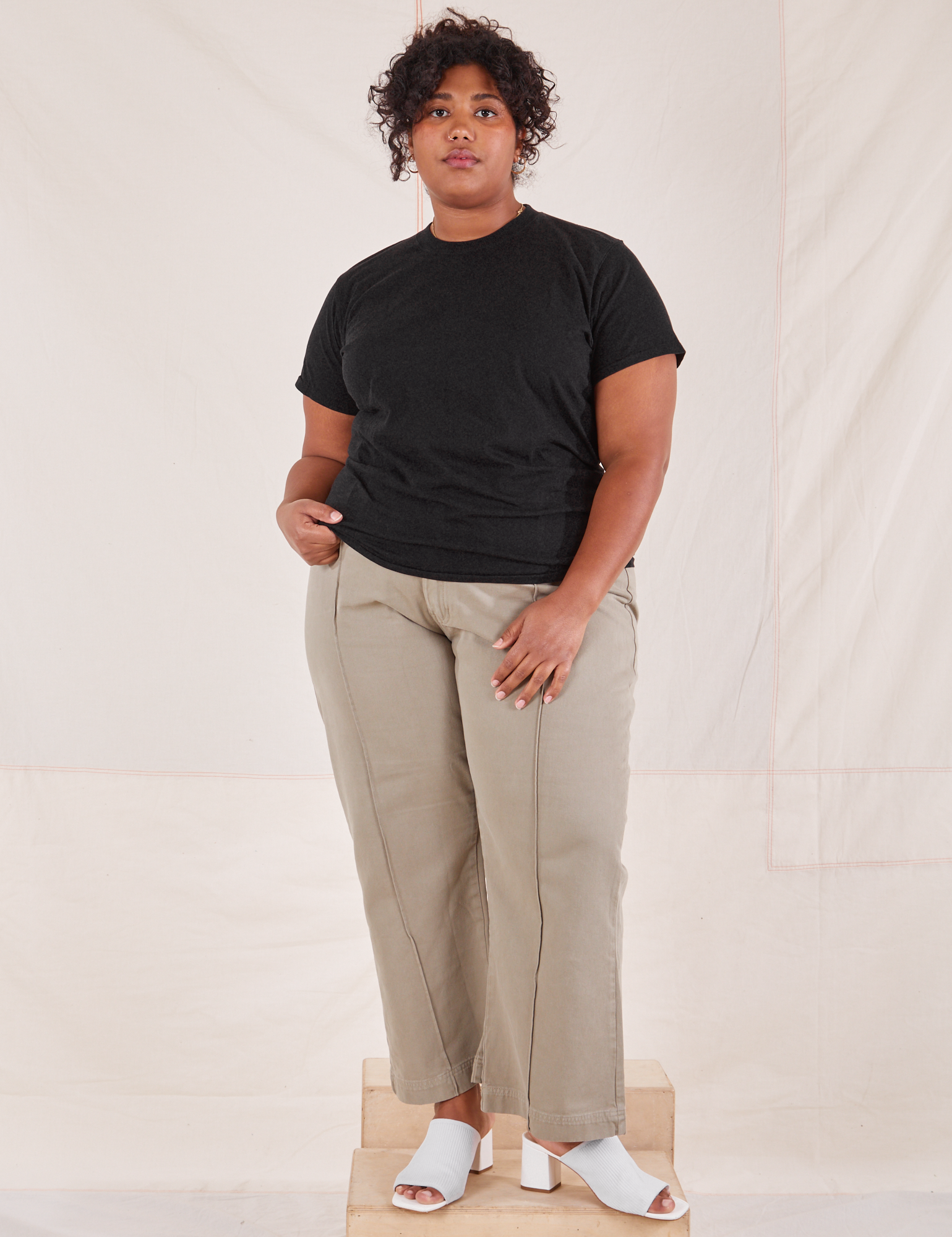 Morgan is wearing L Organic Vintage Tee in Basic Black paired with khaki grey Western Pants
