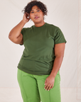 Morgan is wearing Organic Vintage Tee in Dark Emerald Green and gross green Western Pants