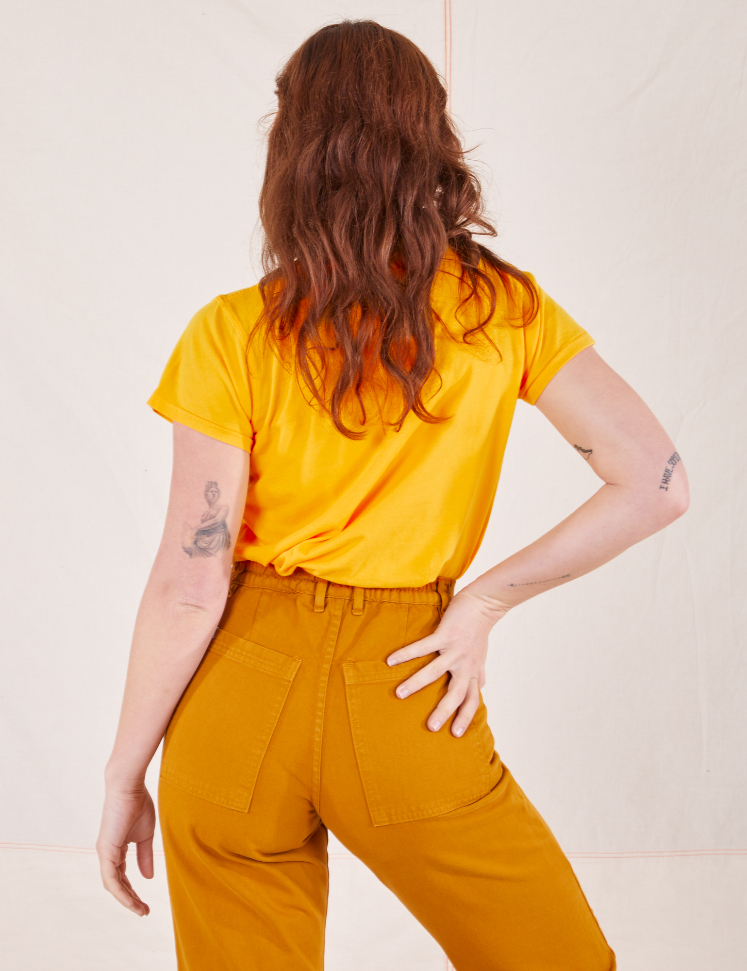 Back view of Organic Vintage Tee in Sunshine Yellow worn by Alex
