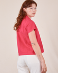 Angled back view of Pantry Button-Up in Hot Pink worn by Alex
