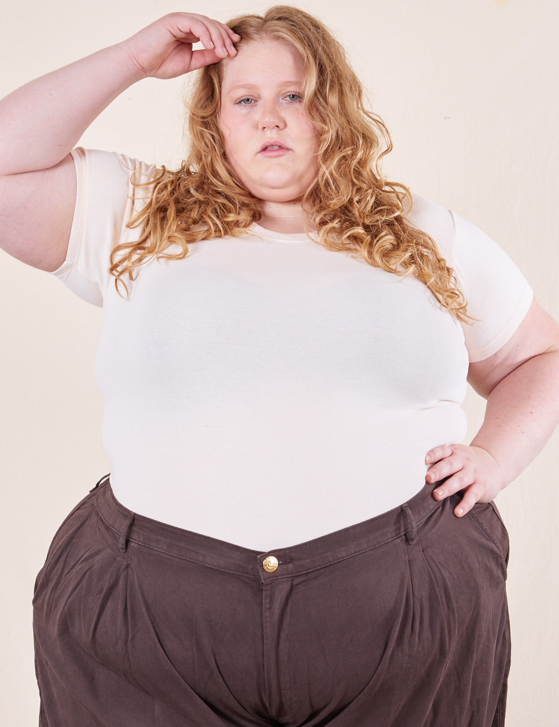 Catie is wearing size 3XL Baby Tee in Vintage Tee White