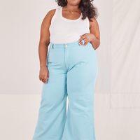 Morgan is 5'5" and wearing 1XL Bell Bottoms in Baby Blue paired with vintage off-white Tank Top