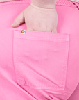 Western Pants in Bubblegum Pink back pocket close up. Worn by Catie with hand in pocket