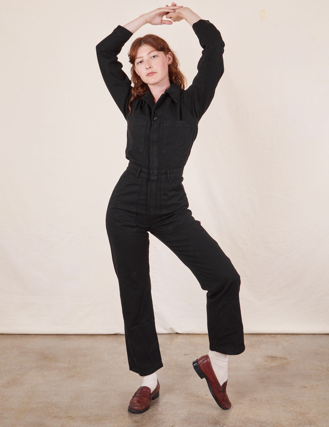 Alex is wearing Everyday Jumpsuit in Basic Black