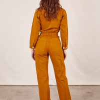 Back view of Everyday Jumpsuit in Spicy Mustard worn by Alex