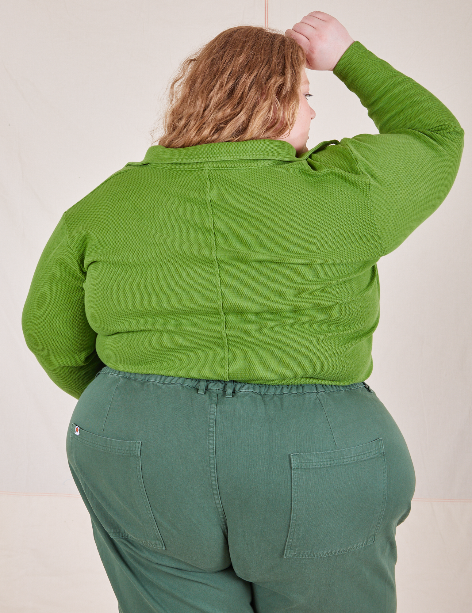 Back view of Long Sleeve Fisherman Polo in Bright Olive worn by Catie