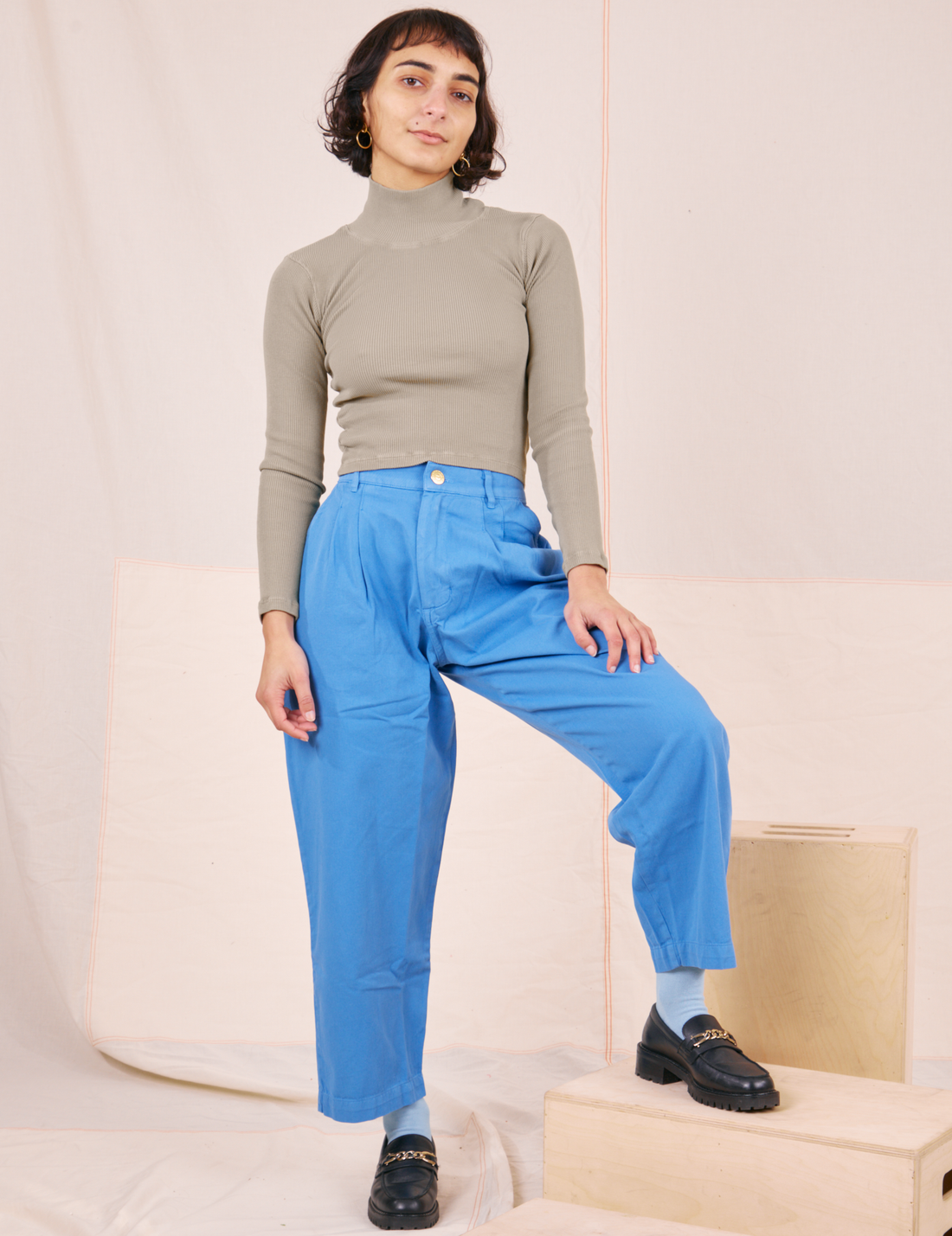 Soraya is wearing Essential Turtleneck in Khaki Grey