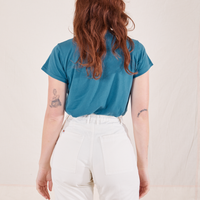 The Organic Vintage Tee in Marine Blue back view on Alex wearing vintage off-white Western Pants
