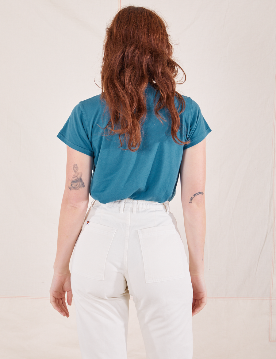 The Organic Vintage Tee in Marine Blue back view on Alex wearing vintage off-white Western Pants