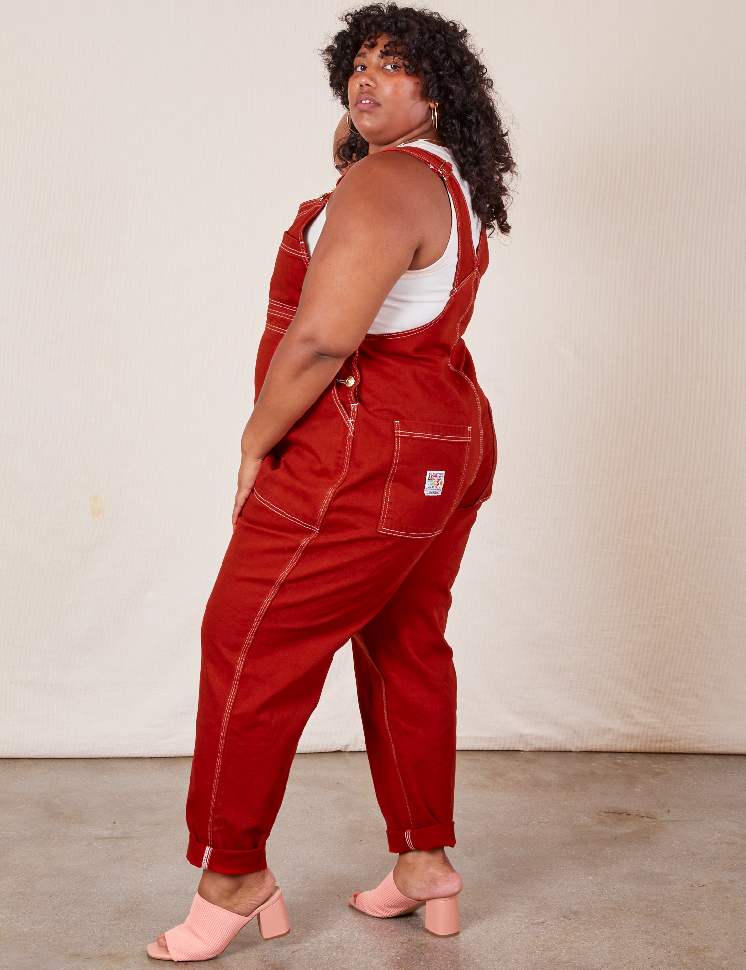 Side view of Original Overalls in Paprika worn by Morgan
