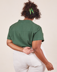 Back view of Pantry Button-Up in Dark Emerald Green worn by Morgan