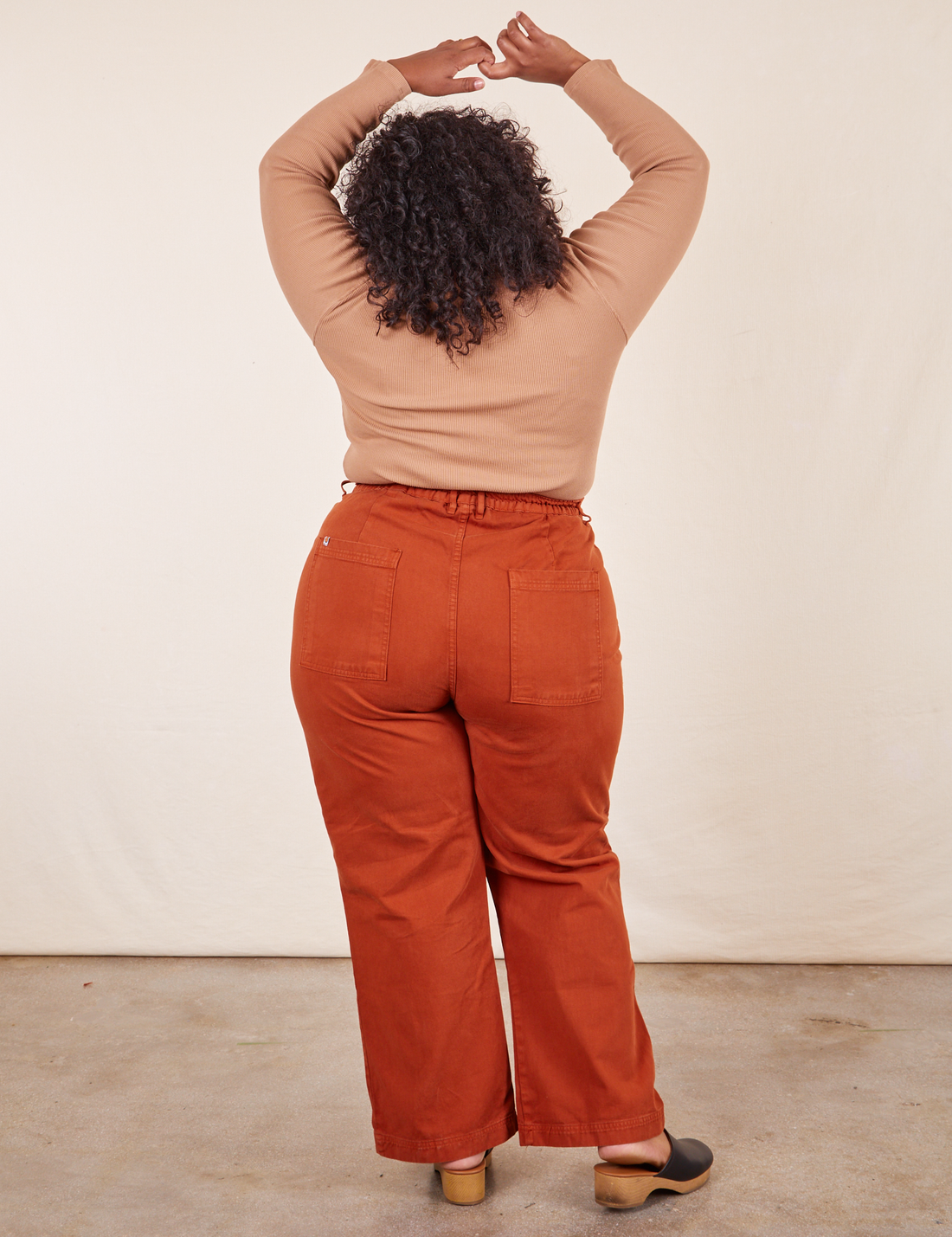 Western Pants in Burnt Terracotta back view on Morgan