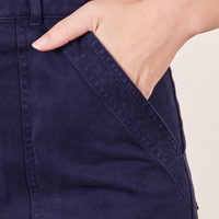 Short Sleeve Jumpsuit in Navy Blue hand in pant pocket on Alex