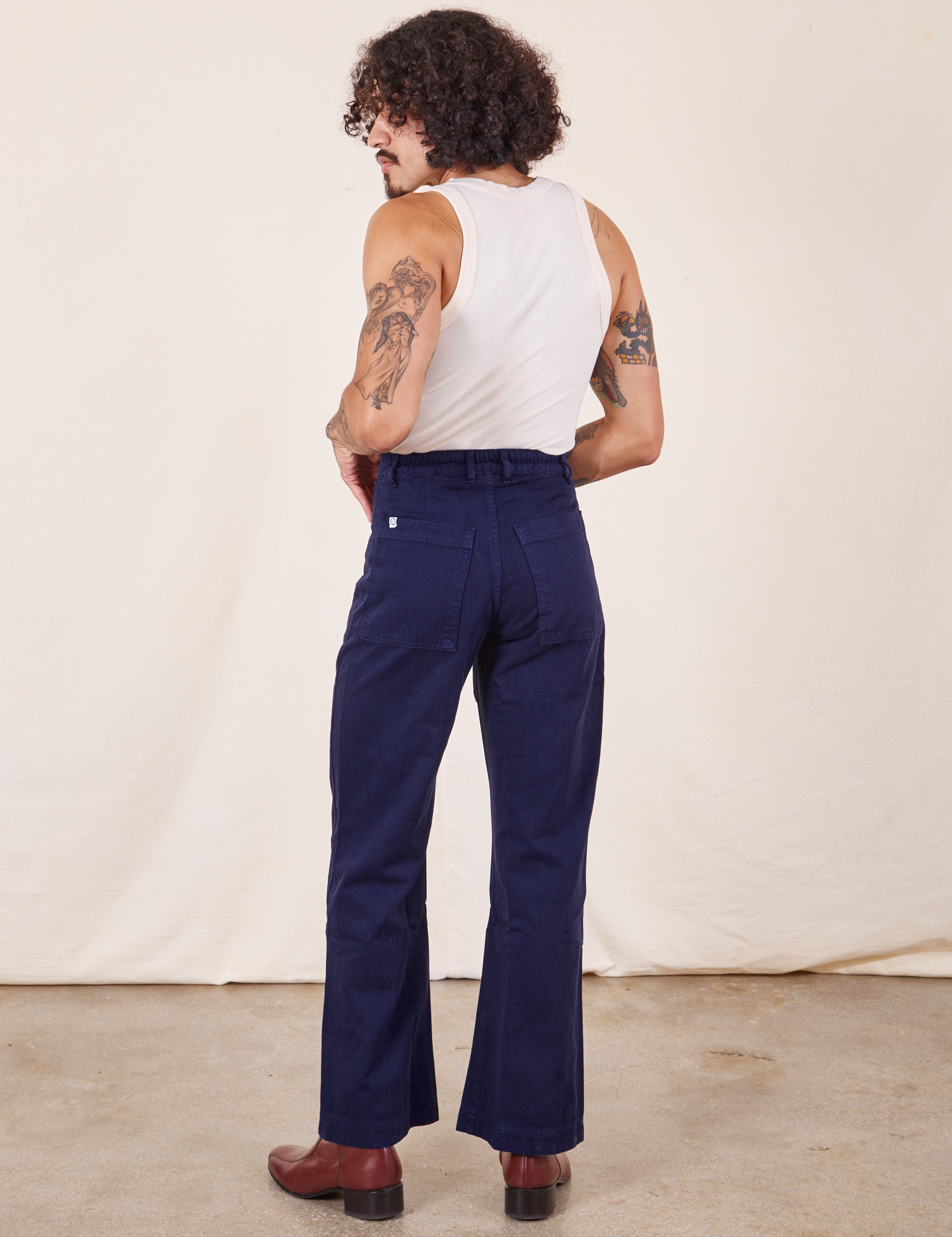 Back view of Western Pants in Navy Blue and vintage off-white Tank Top